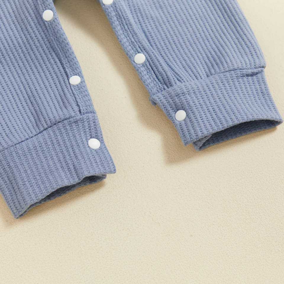 CuddleBaby – Hi, I'm new here – Baby Jumpsuit met Beanie Set